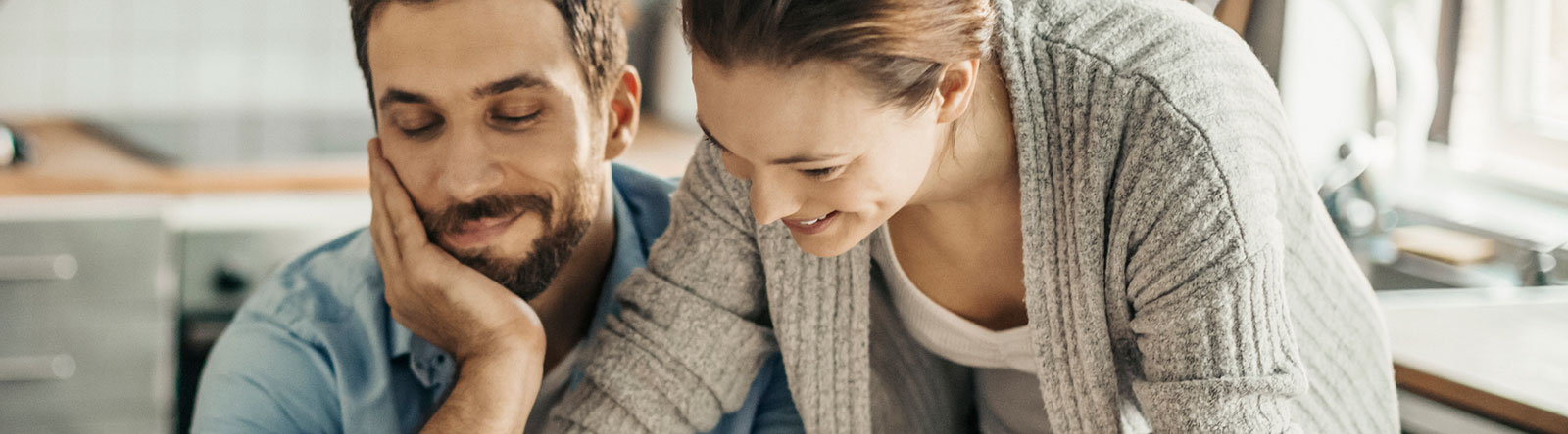 Couple going over finances in their home